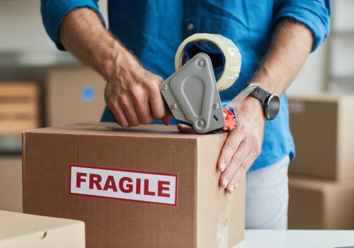 man-packing-box-close-up.jpg